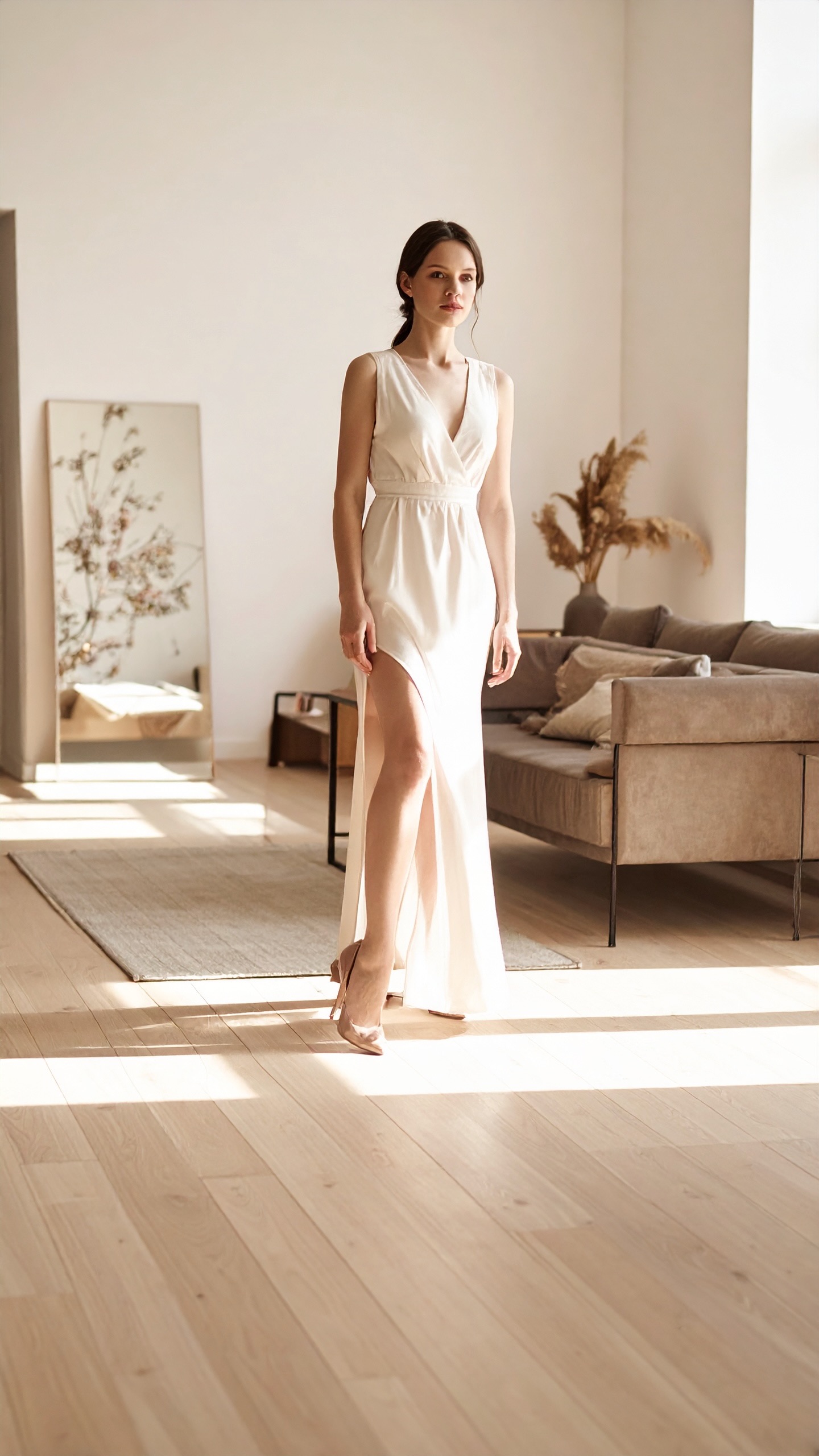 A woman standing in a bright minimal room